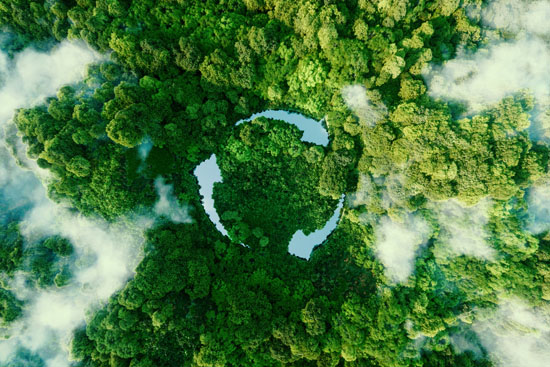 An overhead image of a forest, with clouds and a recycling symbol above them