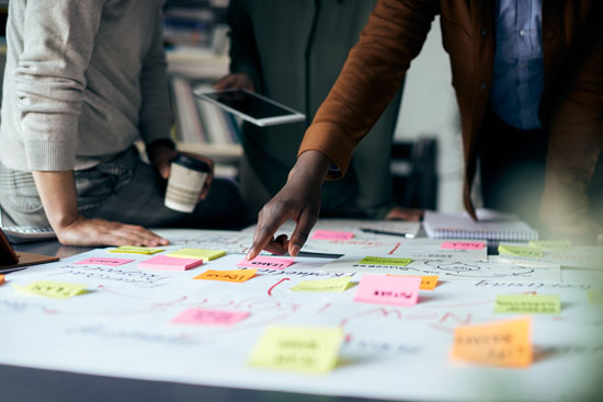 Two people brainstorming in the office