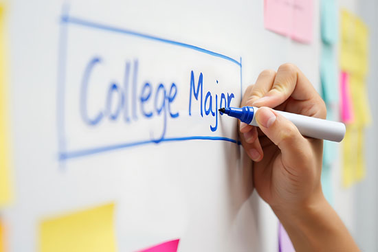 Someone writing 'College Major' on a whiteboard