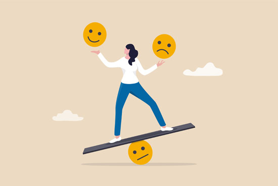 A person balancing on a seesaw holding up different emotions