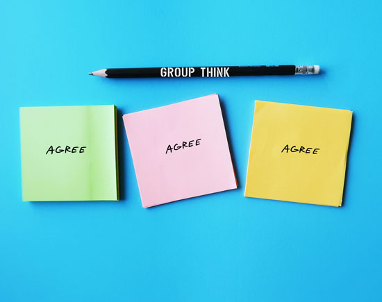 A pencil with 'GROUP THINK' on it is above three sticky notes that say 'AGREE'