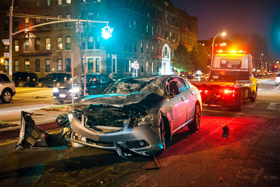 A photograph of a smashed up car