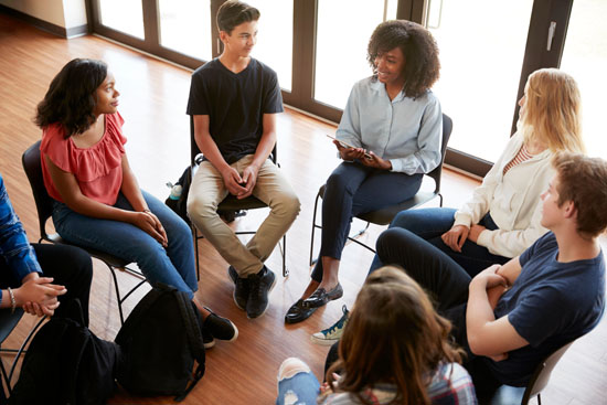 A person leading a group discussion