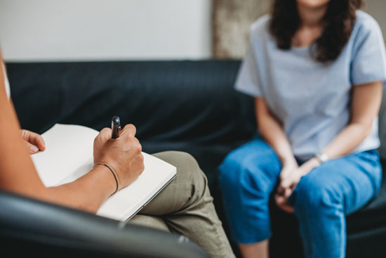 A person talking to a therapist