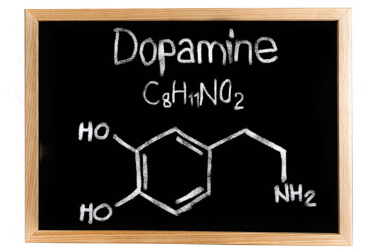 Chalkboard with 'Dopamine', its chemical formula C8H11NO2, and a hand-drawn structural diagram of the molecule