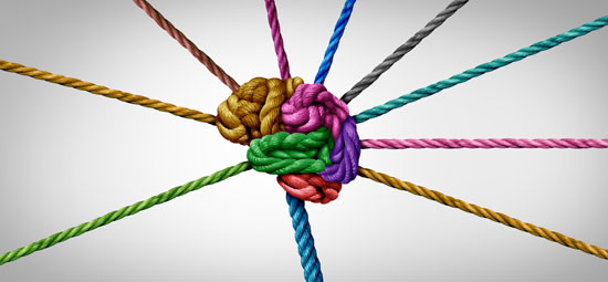 An image of a brain created with different colors of rope, with different colored strands extending out from it