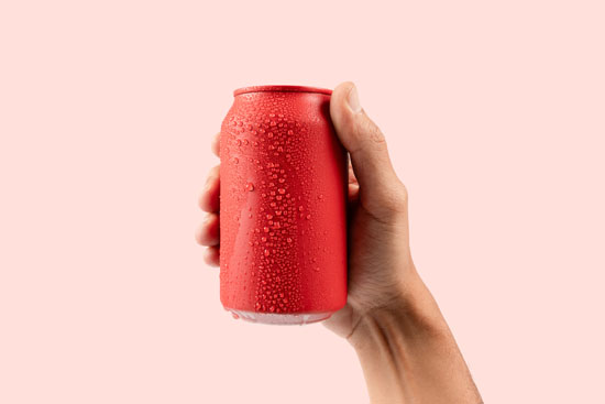 A picture of a hand holding a red can