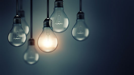 A picture of several light bulbs, with one lit