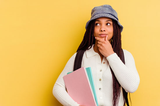 A student looking sideways with a doubtful and skeptical expression